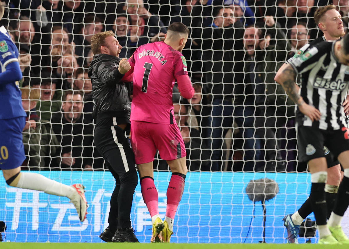 A Chelsea fan pictured barging into Newcastle United goalkeeper Martin Dubravka moments after Mykhailo Mudryk had scored a late equalizer in an EFL Cup quarter-final at Stamford Bridge in December 2023